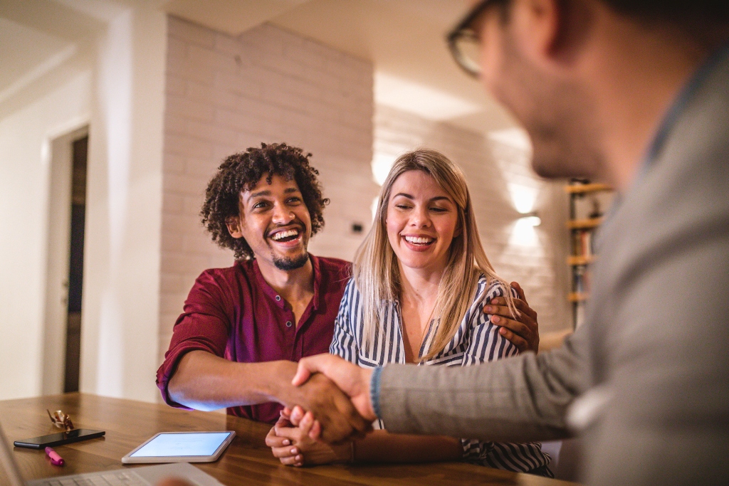 couple negotiating to their real estate agents in california